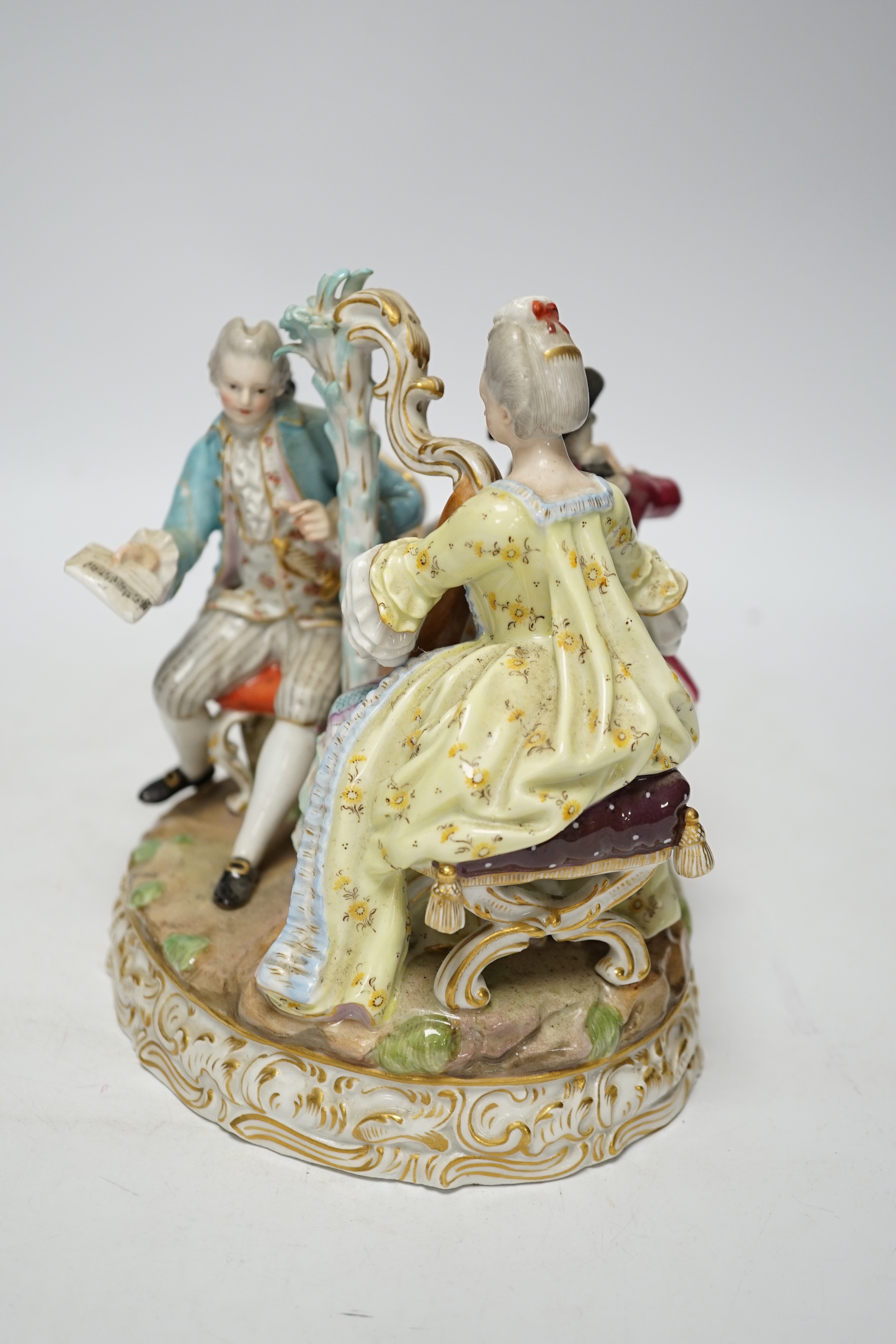 An early 20th century Meissen figure group of musicians, stamped D48, 18cm